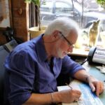 Fred in april 2011 aan het werk aan een schilderij van het Kurhaus, waar nu ook een giclée van gemaakt is.